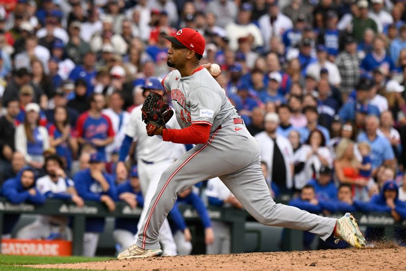 Sep 28, 2024; Chicago, Illinois, USA;  Cincinnati Reds pitcher Alexis Díaz (43) delivers during the eighth inning against the Chicago Cubs at Wrigley Field. Mandatory Credit: Matt Marton-Imagn Images