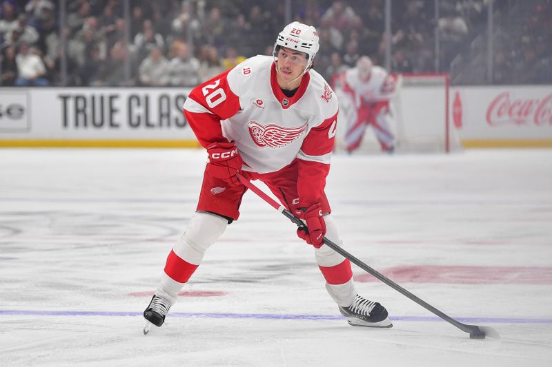 Oct 30, 2025; Los Angeles, California, USA; Detroit Red Wings defenseman Albert Johansson (20) controls the puck against the Los Angeles Kings during the first period at Crypto.com Arena. Mandatory Credit: Gary A. Vasquez-Imagn Images