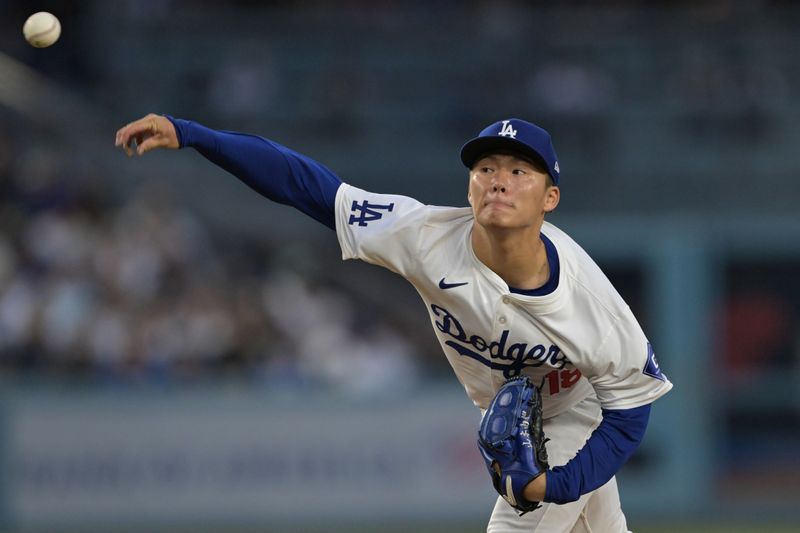 May 20, 2024; Los Angeles, California, USA;  Los Angeles Dodgers starting pitcher Yoshinobu Yamamoto (18) delivers to the plate in the third inning against the Arizona Diamondbacks at Dodger Stadium. Mandatory Credit: Jayne Kamin-Oncea-USA TODAY Sports