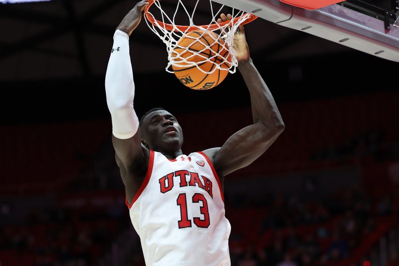 Dec 5, 2023; Salt Lake City, Utah, USA; Utah Utes center Keba Keita (13) dunks the ball against the Southern Utah Thunderbirds during the second half at Jon M. Huntsman Center. Mandatory Credit: Rob Gray-USA TODAY Sports