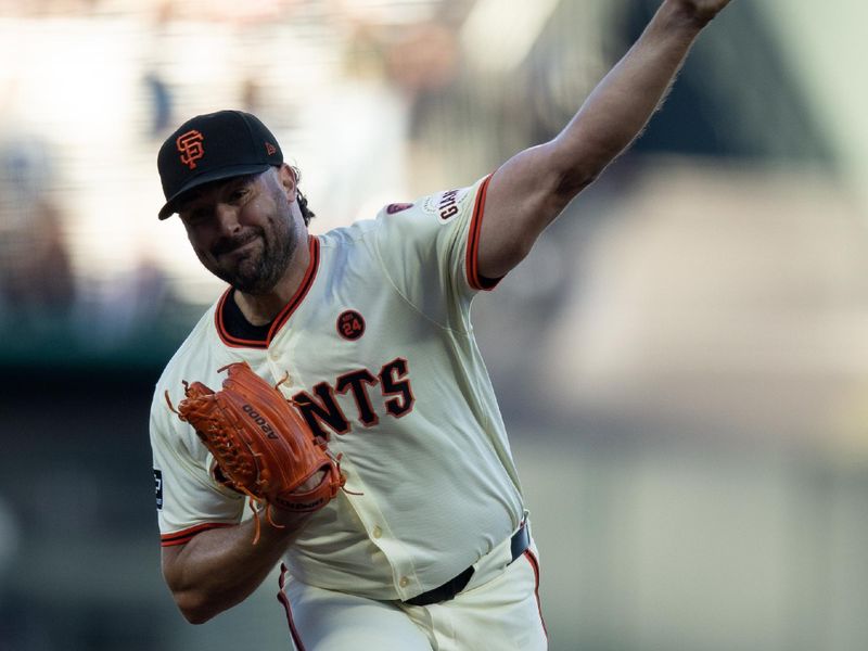 Aug 14, 2024; San Francisco, California, USA; San Francisco Giants starting pitcher Robbie Ray (23) delivers a pitch against the Atlanta Braves during the first inning at Oracle Park. Mandatory Credit: D. Ross Cameron-USA TODAY Sports