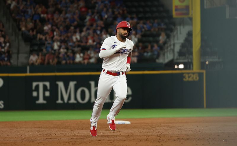 Jun 28, 2023; Arlington, Texas, USA;  Texas Rangers left fielder Ezequiel Duran (20) rounds the bases after hitting a home run during the third inning against the Detroit Tigers at Globe Life Field. Mandatory Credit: Kevin Jairaj-USA TODAY Sports