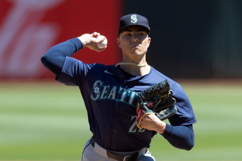 Sep 5, 2024; Oakland, California, USA; Seattle Mariners starting pitcher Bryan Woo (22) delivers a pitch against the Oakland Athletics during the first inning at Oakland-Alameda County Coliseum. Mandatory Credit: D. Ross Cameron-Imagn Images