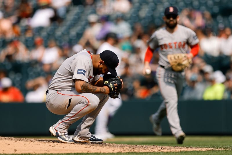Jul 24, 2024; Denver, Colorado, USA; Boston Red Sox first baseman Dominic Smith (2) reacts after pitching in the eighth inning against the Colorado Rockies at Coors Field. Mandatory Credit: Isaiah J. Downing-USA TODAY Sports