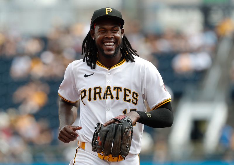 Aug 18, 2024; Pittsburgh, Pennsylvania, USA;  Pittsburgh Pirates shortstop Oneil Cruz (15) reacts as he jogs off of the field at the conclusion of the sixth inning against the Seattle Mariners at PNC Park. Mandatory Credit: Charles LeClaire-USA TODAY Sports