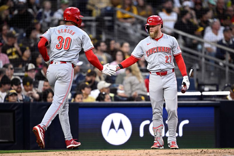 Apr 29, 2024; San Diego, California, USA; Cincinnati Reds center fielder Will Benson (30) is congratulated by right fielder Jake Fraley (27) after scoring a run against the San Diego Padres during the third inning at Petco Park. Mandatory Credit: Orlando Ramirez-USA TODAY Sports