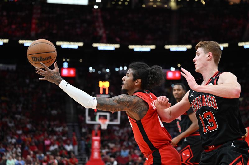 HOUSTON, TEXAS - MARCH 15: Jalen Green #4 of the Houston Rockets reaches for the ball as Kevin Huerter #13 of the Chicago Bulls defends during the first quarter at Toyota Center on March 15, 2025 in Houston, Texas. NOTE TO USER: User expressly acknowledges and agrees that, by downloading and/or using this photograph, user is consenting to the terms and conditions of the Getty Images License Agreement.  (Photo by Jack Gorman/Getty Images)