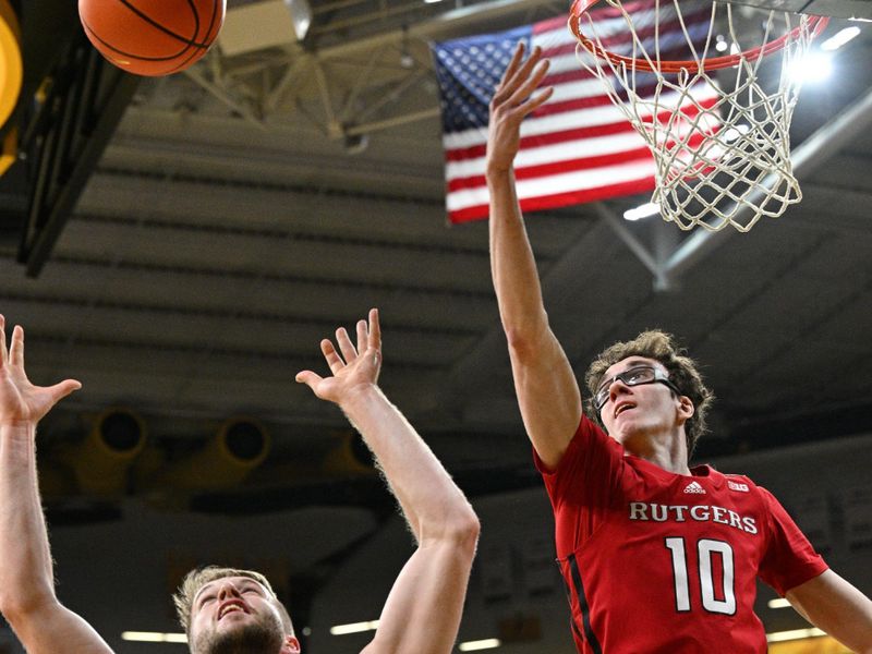 Jan 6, 2024; Iowa City, Iowa, USA; Rutgers Scarlet Knights guard Gavin Griffiths (10) and Iowa Hawkeyes forward Ben Krikke (23) battle for a rebound during the first half at Carver-Hawkeye Arena. Mandatory Credit: Jeffrey Becker-USA TODAY Sports