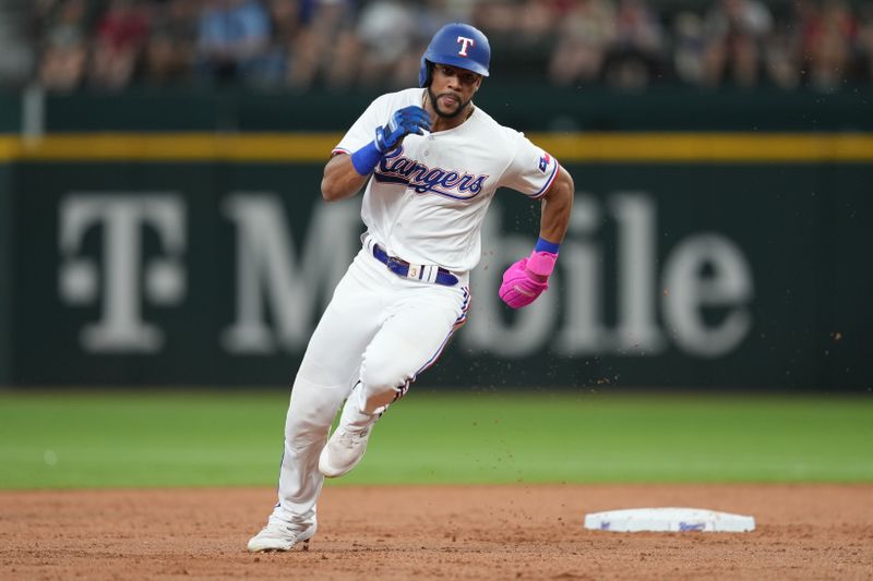 Sep 20, 2023; Arlington, Texas, USA; Texas Rangers center fielder Leody Taveras (3) runs to third base on a double hit by center fielder Evan Carter (not shown) against the Boston Red Sox during the second inning at Globe Life Field. Mandatory Credit: Jim Cowsert-USA TODAY Sports