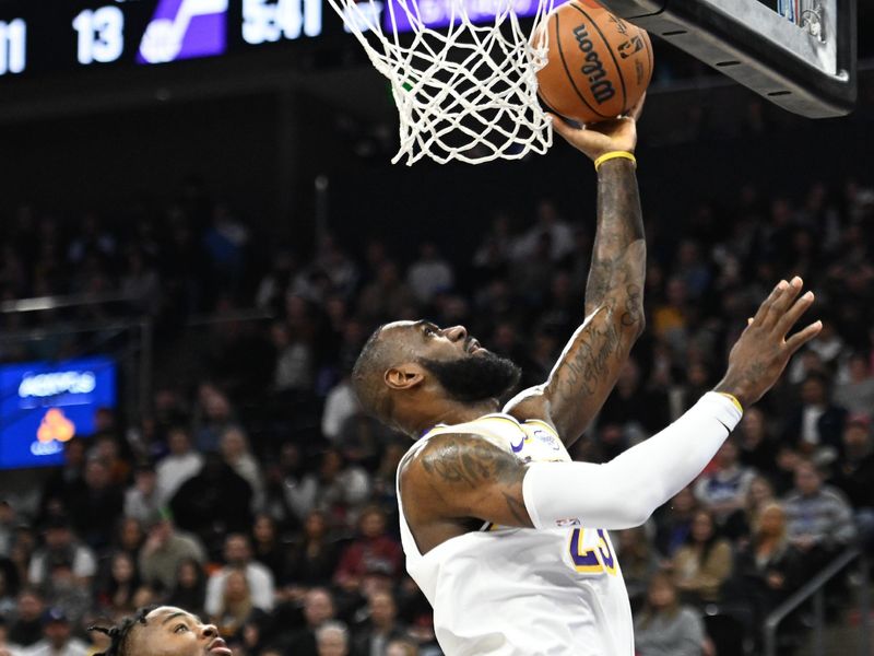 SALT LAKE CITY, UTAH - DECEMBER 01: LeBron James #23 of the Los Angeles Lakers shoots over Isaiah Collier #13 of the Utah Jazz during the first half at Delta Center on December 01, 2024 in Salt Lake City, Utah. NOTE TO USER: User expressly acknowledges and agrees that, by downloading and or using this photograph, User is consenting to the terms and conditions of the Getty Images License Agreement. (Photo by Alex Goodlett/Getty Images)