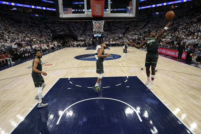 MINNEAPOLIS, MN - MAY 30: Anthony Edwards #5 of the Minnesota Timberwolves rebounds the ball during the game against the Dallas Mavericks during Game 5 of the Western Conference Finals of the 2024 NBA Playoffs on May 30, 2024 at Target Center in Minneapolis, Minnesota. NOTE TO USER: User expressly acknowledges and agrees that, by downloading and or using this Photograph, user is consenting to the terms and conditions of the Getty Images License Agreement. Mandatory Copyright Notice: Copyright 2024 NBAE (Photo by Jordan Johnson/NBAE via Getty Images)