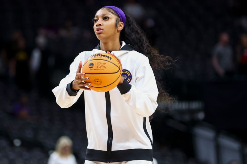 Apr 2, 2023; Dallas, TX, USA; LSU Lady Tigers forward Angel Reese (10) shoots during warmups prior to the game against the Iowa Hawkeyes in the final round of the Women's Final Four NCAA tournament at the American Airlines Center. Mandatory Credit: Kevin Jairaj-USA TODAY Sports