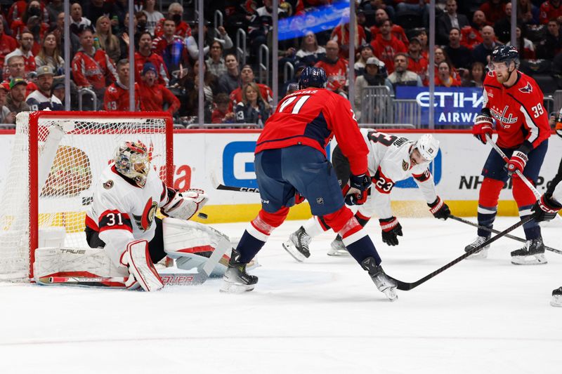 Feb 26, 2024; Washington, District of Columbia, USA; Washington Capitals center Aliaksei Protas (21) scores a goal on Ottawa Senators goaltender Anton Forsberg (31) in the first period at Capital One Arena. Mandatory Credit: Geoff Burke-USA TODAY Sports