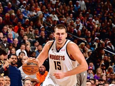 PHOENIX, AZ - DECEMBER 1: Nikola Jokic #15 of the Denver Nuggets dribbles the ball during the game against the Phoenix Suns on December 1, 2023 at Footprint Center in Phoenix, Arizona. NOTE TO USER: User expressly acknowledges and agrees that, by downloading and or using this photograph, user is consenting to the terms and conditions of the Getty Images License Agreement. Mandatory Copyright Notice: Copyright 2023 NBAE (Photo by Barry Gossage/NBAE via Getty Images)