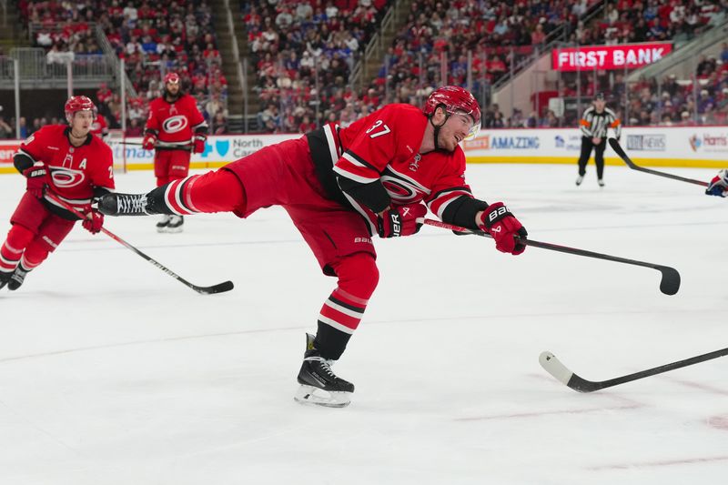 Dec 29, 2025; Raleigh, North Carolina, USA;  Carolina Hurricanes right wing Andrei Svechnikov (37) takes a shot against the New York Rangers during the third period at Lenovo Center. Mandatory Credit: James Guillory-Imagn Images