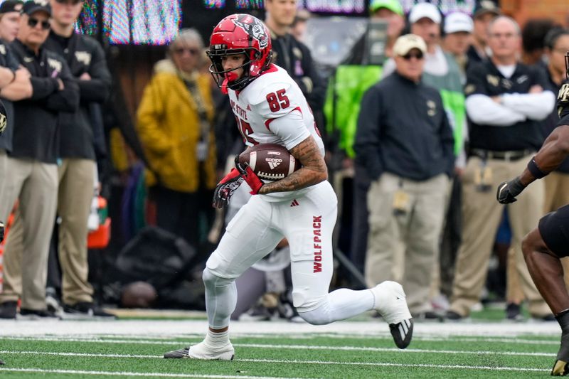 Nov 11, 2023; Winston-Salem, North Carolina, USA; North Carolina State Wolfpack wide receiver Anthony Smith (85) runs for yards after a catch against the Wake Forest Demon Deacons during the first half at Allegacy Federal Credit Union Stadium. Mandatory Credit: Jim Dedmon-USA TODAY Sports