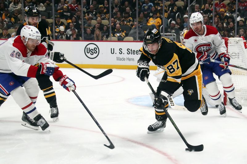 Nov 2, 2024; Pittsburgh, Pennsylvania, USA;  Pittsburgh Penguins center Sidney Crosby (87) clears the puck against Montreal Canadiens right wing Joel Armia (40) during the second period at PPG Paints Arena. Mandatory Credit: Charles LeClaire-Imagn Images