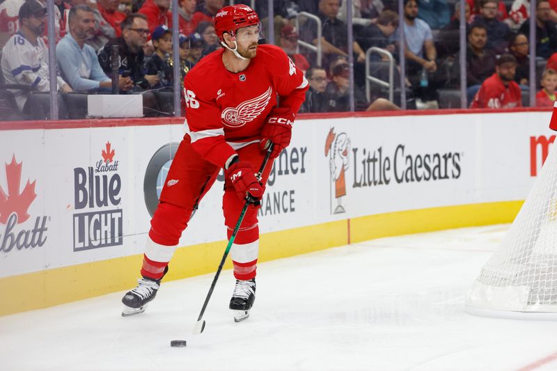 Oct 3, 2024; Detroit, Michigan, USA;  Detroit Red Wings defenseman Jeff Petry (46) skates with the puck in the first period against the Toronto Maple Leafs at Little Caesars Arena. Mandatory Credit: Rick Osentoski-Imagn Images