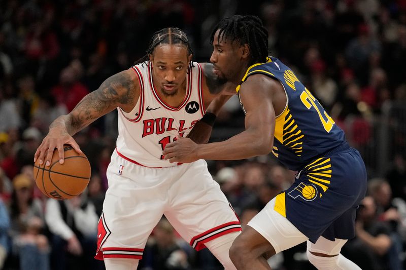 CHICAGO, ILLINOIS - MARCH 27: DeMar DeRozan #11 of the Chicago Bulls dribbles the ball against Aaron Nesmith #23 of the Indiana Pacers during the first half at the United Center on March 27, 2024 in Chicago, Illinois. NOTE TO USER: User expressly acknowledges and agrees that, by downloading and or using this photograph, User is consenting to the terms and conditions of the Getty Images License Agreement. (Photo by Patrick McDermott/Getty Images)