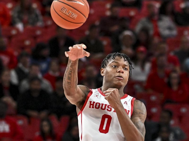 Nov 14, 2022; Houston, Texas, USA; Houston Cougars guard Marcus Sasser (0) saves a loose ball during the second half against the Oral Roberts Golden Eagles at Fertitta Center. Mandatory Credit: Maria Lysaker-USA TODAY Sports