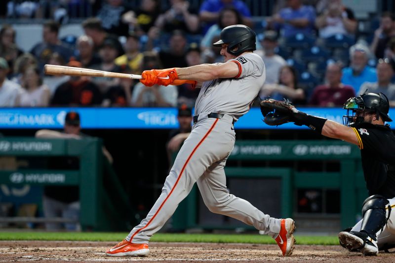 May 22, 2024; Pittsburgh, Pennsylvania, USA;  San Francisco Giants third baseman Matt Chapman (26) hits a two run home run against the Pittsburgh Pirates during the sixth inning at PNC Park. Mandatory Credit: Charles LeClaire-USA TODAY Sports