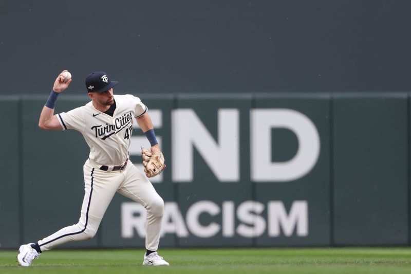 Oct 3, 2023; Minneapolis, Minnesota, USA; Minnesota Twins second baseman Edouard Julien (47) throws the ball to first for and out in the first inning during game one of the Wildcard series for the 2023 MLB playoffs at Target Field. Mandatory Credit: Jesse Johnson-USA TODAY Sports