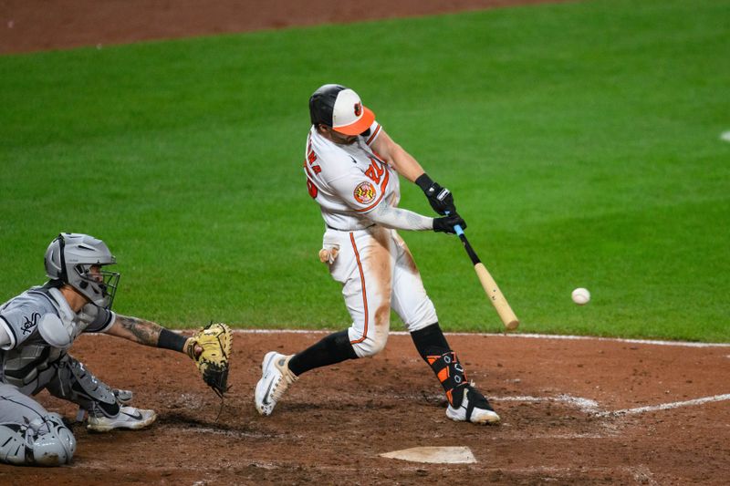 Aug 29, 2023; Baltimore, Maryland, USA; Baltimore Orioles right fielder Ryan McKenna (26) hits a double during the eighth inning against the Chicago White Sox at Oriole Park at Camden Yards. Mandatory Credit: Reggie Hildred-USA TODAY Sports