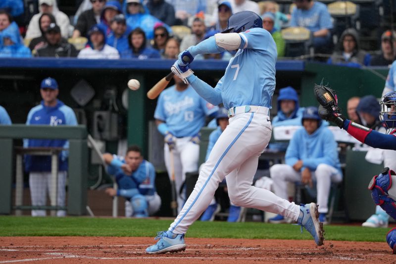 May 5, 2024; Kansas City, Missouri, USA; Kansas City Royals shortstop Bobby Witt Jr. (7) connects for a triple against the Texas Rangers in the first inning at Kauffman Stadium. Mandatory Credit: Denny Medley-USA TODAY Sports