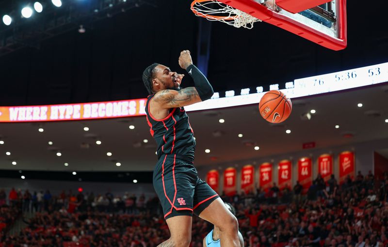 Feb 22, 2023; Houston, Texas, USA; Houston Cougars forward J'Wan Roberts (13) dunks the ball during the second half against the Tulane Green Wave at Fertitta Center. Mandatory Credit: Troy Taormina-USA TODAY Sports