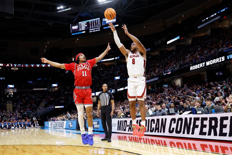 Mar 21, 2025; Cleveland, OH, USA; a8 shoots the ball over Alabama Crimson Tide center Clifford Omoruyi (11) in the second half during the NCAA Tournament First Round at Rocket Arena. Mandatory Credit: Rick Osentoski-Imagn Images