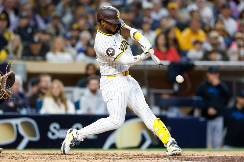 May 28, 2024; San Diego, California, USA; San Diego Padres left fielder Jurickson Profar (10) hits an RBI single in the fifth inning against the Miami Marlins at Petco Park. Mandatory Credit: David Frerker-USA TODAY Sports