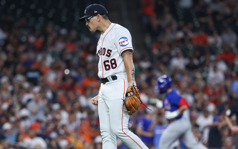 May 17, 2023; Houston, Texas, USA; Houston Astros starting pitcher J.P. France (68) reacts and Chicago Cubs right fielder Seiya Suzuki (27) rounds the bases after hitting a home run during the third inning at Minute Maid Park. Mandatory Credit: Troy Taormina-USA TODAY Sports