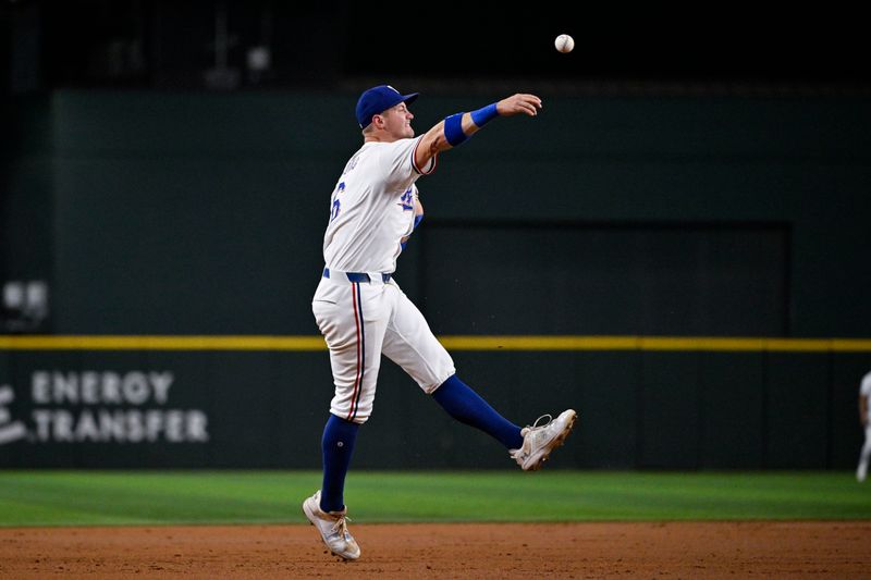 Sep 2, 2024; Arlington, Texas, USA; Texas Rangers third baseman Josh Jung (6) throws to first base during the third inning against the New York Yankees at Globe Life Field. Mandatory Credit: Jerome Miron-USA TODAY Sports