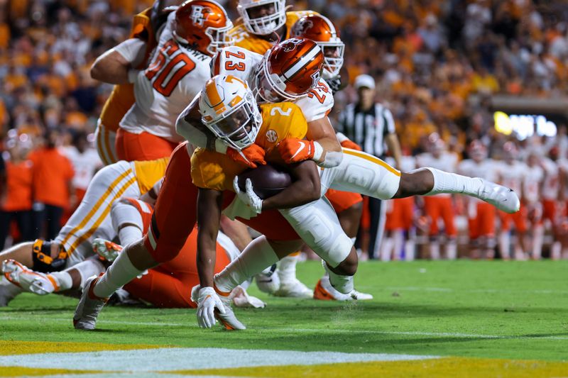 Sep 2, 2021; Knoxville, Tennessee, USA; Tennessee Volunteers running back Jabari Small (2) runs for a touchdown against Bowling Green Falcons linebacker Darren Anders (23) during the first quarter at Neyland Stadium. Mandatory Credit: Randy Sartin-USA TODAY Sports