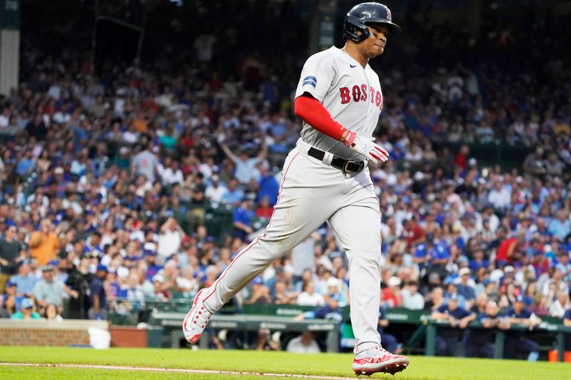 Jul 14, 2023; Chicago, Illinois, USA; Boston Red Sox third baseman Rafael Devers (11) runs the bases after hitting a home run against the Chicago Cubs during the third inning at Wrigley Field. Mandatory Credit: David Banks-USA TODAY Sports 