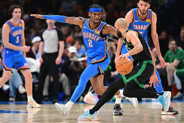 OKLAHOMA CITY, OKLAHOMA - JANUARY 2: Shai Gilgeous-Alexander #2 of the Oklahoma City Thunder defends Derrick White #9 of the Boston Celtics during the second half at Paycom Center on January 2, 2024 in Oklahoma City, Oklahoma. NOTE TO USER: User expressly acknowledges and agrees that, by downloading and or using this Photograph, user is consenting to the terms and conditions of the Getty Images License Agreement. (Photo by Joshua Gateley/Getty Images)