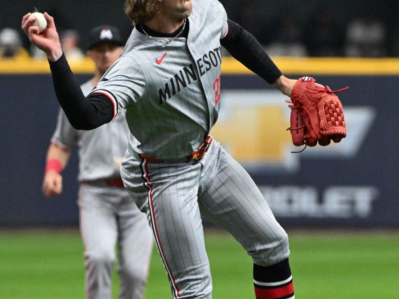 Apr 3, 2024; Milwaukee, Wisconsin, USA; Minnesota Twins starting pitcher Chris Paddack (20) throws a ball to first base against the Milwaukee Brewers in the first inning at American Family Field. Mandatory Credit: Michael McLoone-USA TODAY Sports