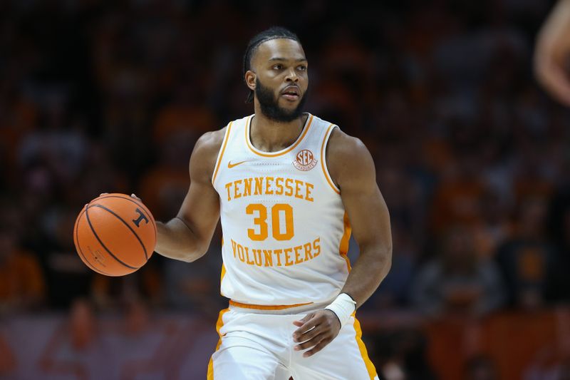 Dec 5, 2023; Knoxville, Tennessee, USA; Tennessee Volunteers guard Josiah-Jordan James (30) dribbles against the George Mason Patriots during the first half at Thompson-Boling Arena at Food City Center. Mandatory Credit: Randy Sartin-USA TODAY Sports