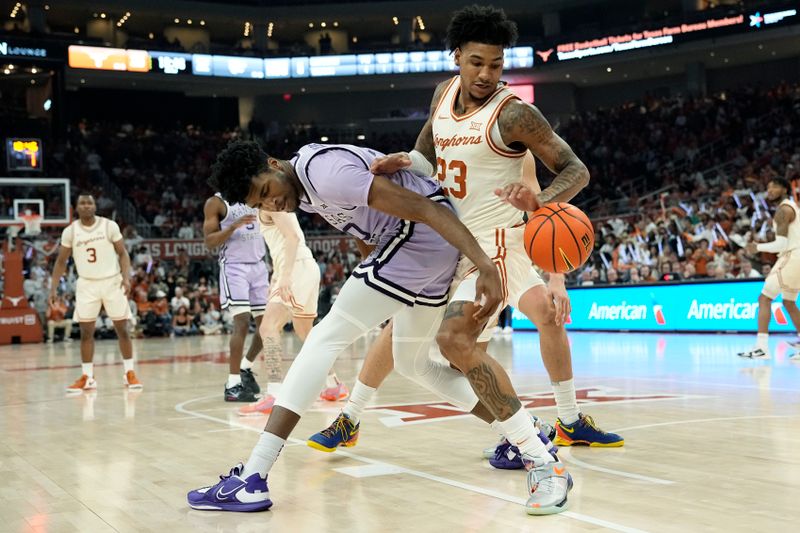 Feb 19, 2024; Austin, Texas, USA; Texas Longhorns forward Dillon Mitchell (23) and Kansas State Wildcats forward Jerrell Colbert (20) battle for the loose ball during the second half at Moody Center. Mandatory Credit: Scott Wachter-USA TODAY Sports