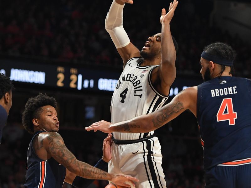 Feb 18, 2023; Nashville, Tennessee, USA; Vanderbilt Commodores guard Jordan Wright (4) has the ball knocked away by Auburn Tigers guard Tre Donaldson (3) during the second half at Memorial Gymnasium. Mandatory Credit: Christopher Hanewinckel-USA TODAY Sports