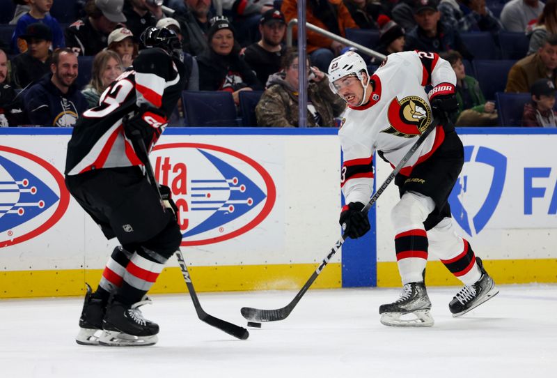 Jan 11, 2024; Buffalo, New York, USA;  Buffalo Sabres defenseman Ryan Johnson (33) blocks a shot by Ottawa Senators defenseman Travis Hamonic (23) during the second period at KeyBank Center. Mandatory Credit: Timothy T. Ludwig-USA TODAY Sports