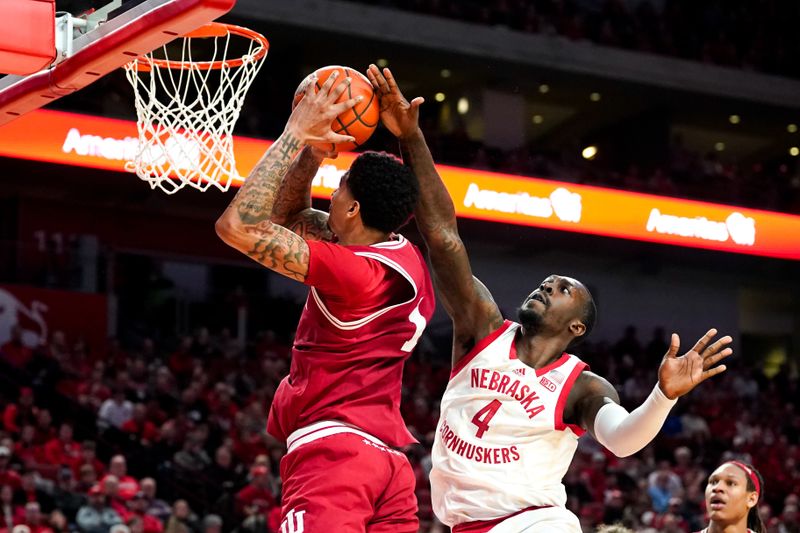 Jan 3, 2024; Lincoln, Nebraska, USA; Nebraska Cornhuskers forward Juwan Gary (4) blocks a shot by Indiana Hoosiers center Kel'el Ware (1) during the second half at Pinnacle Bank Arena. Mandatory Credit: Dylan Widger-USA TODAY Sports