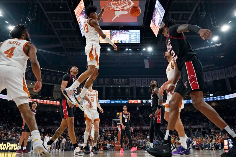 Jan 6, 2024; Austin, Texas, USA; Texas Longhorns forward Dillon Mitchell (23) dunks during the second half against the Texas Tech Red Raiders at Moody Center. Mandatory Credit: Scott Wachter-USA TODAY Sports