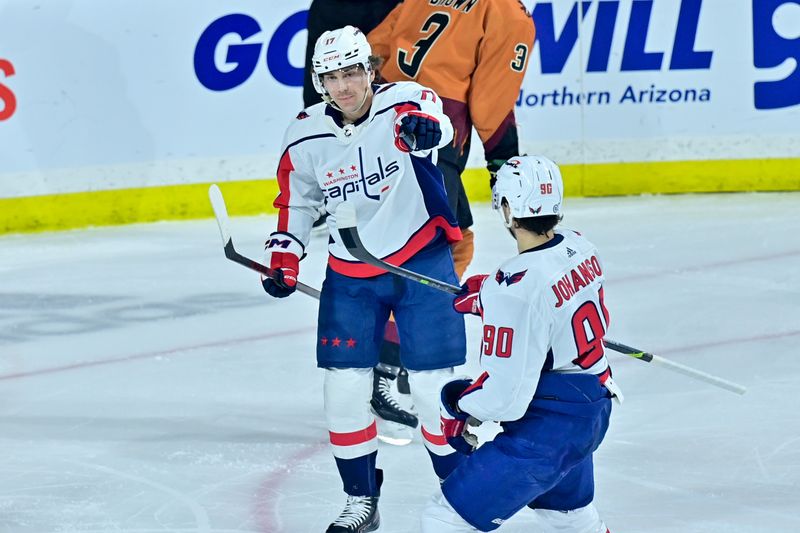 Jan 19, 2023; Tempe, Arizona, USA; Washington Capitals center Dylan Strome (17) celebrates with left wing Marcus Johansson (90) after scoring a goal in the third period against the Arizona Coyotes at Mullett Arena. Mandatory Credit: Matt Kartozian-USA TODAY Sports