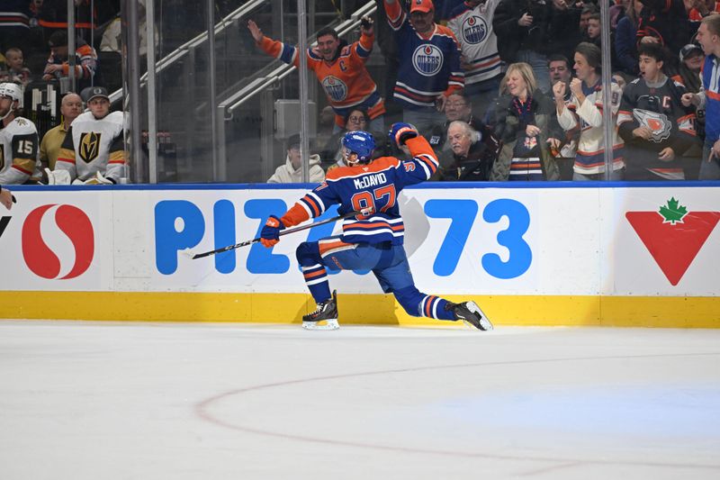 Dec 21, 2025; Edmonton, Alberta, CAN; Edmonton Oilers center Connor McDavid (97) celebrates a goal on Vegas Golden Knights goalie Carter Hart (79) during the first period at Rogers Place. Mandatory Credit: Walter Tychnowicz-Imagn Images