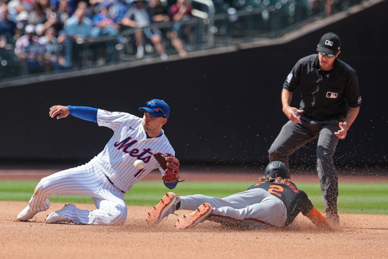 Aug 21, 2024; New York City, New York, USA; Baltimore Orioles shortstop Gunnar Henderson (2) steals second base as New York Mets second baseman Jose Iglesias (11) catches a throw during the seventh inning at Citi Field. Mandatory Credit: Vincent Carchietta-USA TODAY Sports