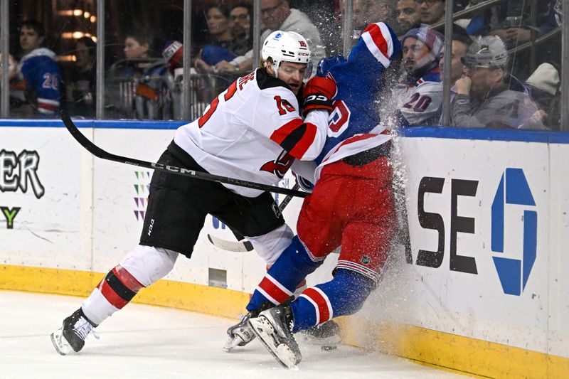 Dec 2, 2024; New York, New York, USA;  New Jersey Devils right wing Nathan Legare (16) checks New York Rangers defenseman Ryan Lindgren (55) into the boards during the first period at Madison Square Garden. Mandatory Credit: Dennis Schneidler-Imagn Images