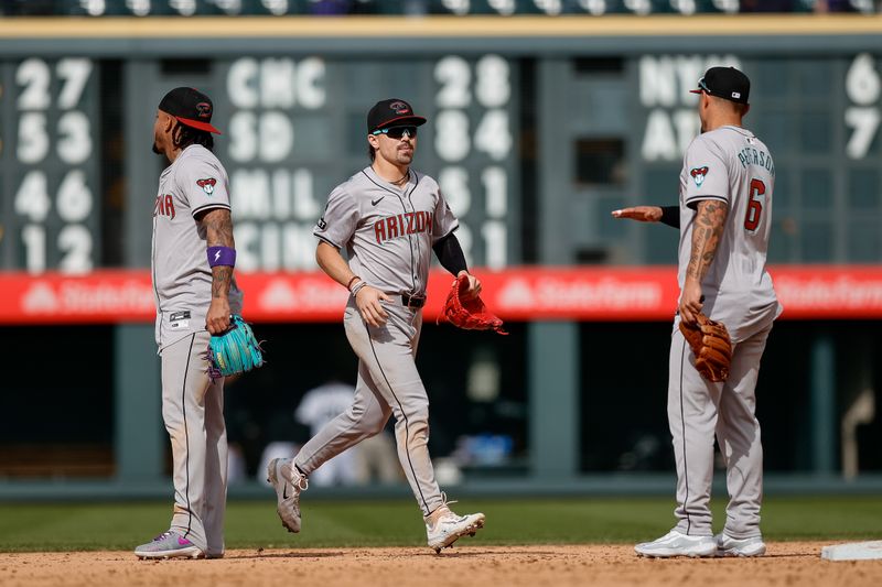 Apr 10, 2024; Denver, Colorado, USA; Arizona Diamondbacks center fielder Corbin Carroll (7) celebrates with designated hitter Ketel Marte (4) and pinch hitter Jace Peterson (6) after the game against the Colorado Rockies at Coors Field. Mandatory Credit: Isaiah J. Downing-USA TODAY Sports