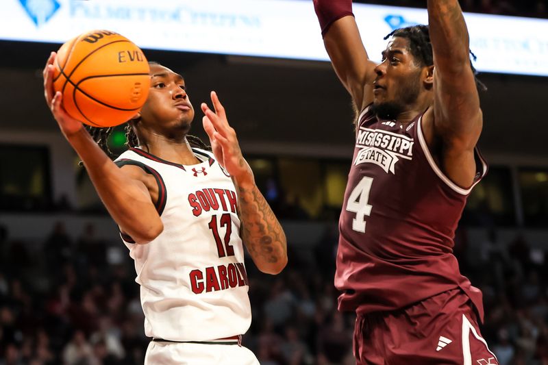 Jan 6, 2024; Columbia, South Carolina, USA; South Carolina Gamecocks guard Zachary Davis (12) passes around Mississippi State Bulldogs forward Cameron Matthews (4) in the first half at Colonial Life Arena. Mandatory Credit: Jeff Blake-USA TODAY Sports