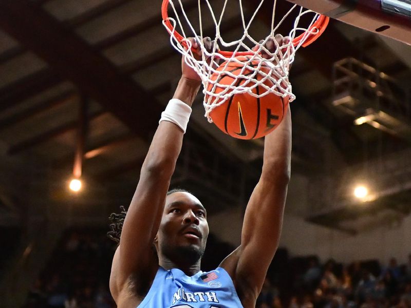 Mar 4, 2025; Blacksburg, Virginia, USA;  North Carolina Tar Heels forward Jae'Lyn Withers (24) dunks the ball against Virginia Tech Hokies during the second half at Cassell Coliseum. Mandatory Credit: Brian Bishop-Imagn Images